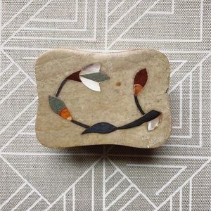 small stone box with floral inlay on lid